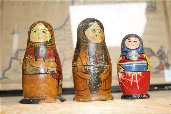 A Black Forest Bear string puppet, various Russian dolls and two carved figures